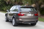 2013 BMW X5 xDrive50i in Sparkling Bronze Metallic - Driving Rear Left View